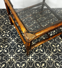 Load image into Gallery viewer, Stunning intertwined woven corners with magnificent craftsmanship finish towards the bottom of a bamboo rack to store books or newspapers come with a sleek glass top.