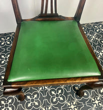 Load image into Gallery viewer, The mahogany chair with shaped backrest has a beautifully shaped finish with a piercing splat with a harp design, drop-in seats in a nice green tone leather type material, with one minor scuff and the padding, had fallen it, on lovely cabriole legs