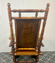 Load image into Gallery viewer, Upholstered in a rich green fabric with hints of orange peeking through, this chair embodies an authentic autumnal aesthetic. The material and inner padding remain in good condition, ensuring style and comfort