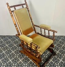Load image into Gallery viewer, Upholstered in a rich green fabric with hints of orange peeking through, this chair embodies an authentic autumnal aesthetic. The material and inner padding remain in good condition, ensuring style and comfort
