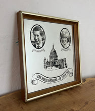 Load image into Gallery viewer, Vibrant mirror featuring the wedding of Charles and Diana on the 29th of July 1981 with a portrait of the couple and intricate picture of St Pauls and the fonts in a banner design.