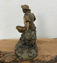 Load image into Gallery viewer, Wonderful late 19th-century antique gilded spelter material figurine with a copper finish featuring a majestic chap sitting upon a haystack with a scythe in his left hand and a cut a piece of hay that he had been working on