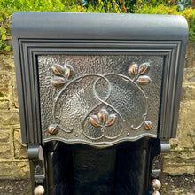 Load image into Gallery viewer, Beautiful antique Victorian Art Nouveau fireplace. Elegant design in cast iron with pewter insert and beautiful stylised sinuous floral copper decorations.