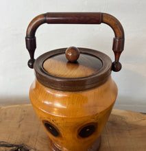 Load image into Gallery viewer, This wonderful vintage-turned wood caddy, with an attractive lid and handle, has a natural wood finish in the design, charming grain, and excellent craftsmanship. It is an elegant and functional addition to your home decor.