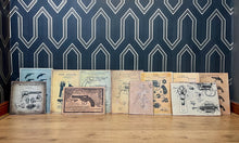 Load image into Gallery viewer, A selection of eleven gun and revolver art pictures with stunning deals created in a vintage style and printed on old wooden sheets likely to be developed in the 90s
