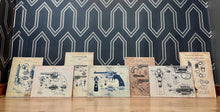Load image into Gallery viewer, This collection features seven stunning vintage-style artworks of guns, revolvers, and shotguns. These prints, likely created in the 1990s, are displayed on old wooden sheets.