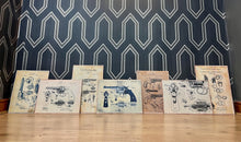 Load image into Gallery viewer, This collection features seven stunning vintage-style artworks of guns, revolvers, and shotguns. These prints, likely created in the 1990s, are displayed on old wooden sheets.
