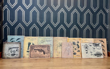 Load image into Gallery viewer, A selection of eleven gun and revolver art pictures with stunning deals created in a vintage style and printed on old wooden sheets likely to be developed in the 90s