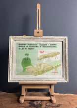 Load image into Gallery viewer, This striking image showcases a dedicated worker in an ammunition loading factory, meticulously engaged in the shell manufacturing process. The poster features a stylish finish, adding an artistic flair to its historical significance.