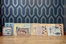 Load image into Gallery viewer, A selection of eleven gun and revolver art pictures with stunning deals created in a vintage style and printed on old wooden sheets likely to be developed in the 90s