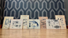 Load image into Gallery viewer, This collection features seven stunning vintage-style artworks of guns, revolvers, and shotguns. These prints, likely created in the 1990s, are displayed on old wooden sheets.
