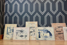 Load image into Gallery viewer, This collection features seven stunning vintage-style artworks of guns, revolvers, and shotguns. These prints, likely created in the 1990s, are displayed on old wooden sheets.