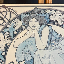 Load image into Gallery viewer, This vintage art nouveau wooden wall plaque, with a blue effect, is a unique piece of art. It features an elegant lady wearing an attractive headdress, her hair tied up, and a selection of glamorous clothing.