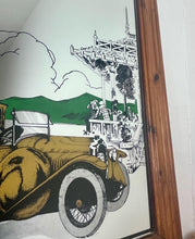 Load image into Gallery viewer, Wonderful vintage automobile mirror featuring an prestige car in mustard tones with the driver and the well dressed couple in the back, bird watching and mountainous background with a selection on people and intricate building.