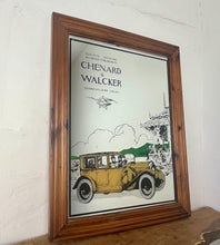 Load image into Gallery viewer, Wonderful vintage automobile mirror featuring an prestige car in mustard tones with the driver and the well dressed couple in the back, bird watching and mountainous background with a selection on people and intricate building.