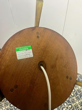 Load image into Gallery viewer, Vintage Scandinavian designer Teak Floor Lamp. This stunning teak floor lamp features a circular base with stylish brass details paired with a mustard fabric lamp shade. It is perfect as an additional light in your living room or workspace.