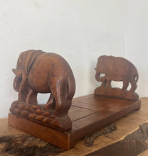 Load image into Gallery viewer, Mid-century vintage bookends extend out with stylish carved elephants with fold-down hinges.
