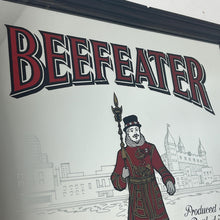 Load image into Gallery viewer, The stunning design features the famous London gin brand in vivid red fonts, a vibrant gold background, and a picture of the familiar logo on the King Body Guard of the Yeomen of the Guard (Beefeater).