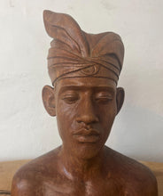 Load image into Gallery viewer, This vintage Balinese teak sculpture features a bust of a man wearing a traditional headdress. With its intricate details and exquisite craftsmanship, this piece is a one-of-a-kind decorative collectable.