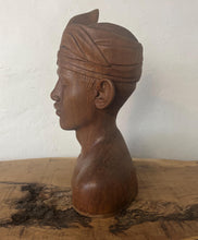 Load image into Gallery viewer, This vintage Balinese teak sculpture features a bust of a man wearing a traditional headdress. With its intricate details and exquisite craftsmanship, this piece is a one-of-a-kind decorative collectable.