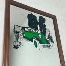 Load image into Gallery viewer, A Stylish Renault advertising mirror features a classic car with stand-out green detail. The couple wears elegant clothing and looks at their map against a woodland noir background.