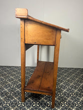 Load image into Gallery viewer, Excellent pitch pine clerk desk with raised back and sloped writing surface over a single fall-front cupboard with key, raised on square supports united by under-tier two plank pine shelf.