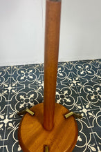 Load image into Gallery viewer, Vintage Scandinavian designer Teak Floor Lamp. This stunning teak floor lamp features a circular base with stylish brass details paired with a mustard fabric lamp shade. It is perfect as an additional light in your living room or workspace.