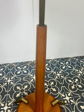 Load image into Gallery viewer, Vintage Scandinavian designer Teak Floor Lamp. This stunning teak floor lamp features a circular base with stylish brass details paired with a mustard fabric lamp shade. It is perfect as an additional light in your living room or workspace.