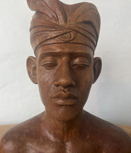 Load image into Gallery viewer, This vintage Balinese teak sculpture features a bust of a man wearing a traditional headdress. With its intricate details and exquisite craftsmanship, this piece is a one-of-a-kind decorative collectable.