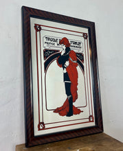 Load image into Gallery viewer, Stunning Mucha mirror featuring vibrant tones featuring a large detailed picture of the figure in orange and black with an intricate pattern border following with the same colours and bold vivid fonts to create a stand out design.
