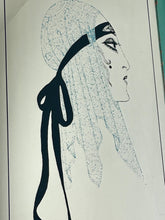 Load image into Gallery viewer, A collectible advertising piece featuring a glamorous lady in a vintage-style scarf bandana with her ribbon flowing down, posing thoughtfully. The mirror has a stylish feel and a noir finish with hint if colour. It is an excellent wall art piece to add a nice touch to your home.