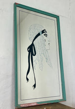 Load image into Gallery viewer, A collectible advertising piece featuring a glamorous lady in a vintage-style scarf bandana with her ribbon flowing down, posing thoughtfully. The mirror has a stylish feel and a noir finish with hint if colour. It is an excellent wall art piece to add a nice touch to your home.