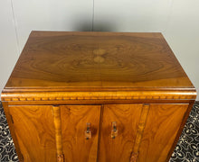 Load image into Gallery viewer, This cabinet contains a long cupboard with vivid-tone burr walnut doors on either side and a stunning detailed design. It has two shelves underneath for extra storage, making it the perfect place to store your martini accessories.