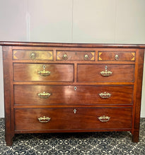 Load image into Gallery viewer, This is a classic late Georgian, mahogany, English chest of drawers dating to early c.1800.This large chest has seven drawers: three small drawers, two medium drawers, and two full-length drawers. It offers generous storage in an elegant and practical form.