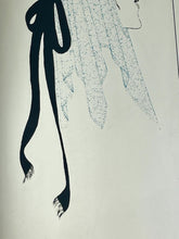 Load image into Gallery viewer, A collectible advertising piece featuring a glamorous lady in a vintage-style scarf bandana with her ribbon flowing down, posing thoughtfully. The mirror has a stylish feel and a noir finish with hint if colour. It is an excellent wall art piece to add a nice touch to your home.