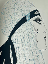 Load image into Gallery viewer, A collectible advertising piece featuring a glamorous lady in a vintage-style scarf bandana with her ribbon flowing down, posing thoughtfully. The mirror has a stylish feel and a noir finish with hint if colour. It is an excellent wall art piece to add a nice touch to your home.