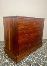 Load image into Gallery viewer, An immaculate quality Arts & Crafts chest of drawers made in figured English mahogany. Having an arrangement of 2 over 2 drawers, all retaining the original decorative handles and escutcheons. With mahogany sides on a plinth. Beautiful original condition throughout. English, Circa 1900.
