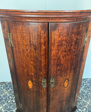 Load image into Gallery viewer, All original brass hinges and escutcheons, fancy rococo brass escutcheons and brass H-hinges and beautifully figured oak doors with mahogany banding to the edges and beautiful shell inlay design with multiple tones of veneer above a shaped pelmet.