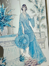 Load image into Gallery viewer, Beautiful Art Nouveau lady mirror featuring a glamorous lady with an elegant blue dress and hat with a Victorian Manor House background with a fountain, and wonderful matte effect tones.