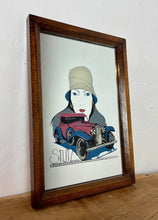Load image into Gallery viewer, This mirror features an Art Deco-style illustration of a woman wearing a cloche hat alongside a vintage Stutz automobile, with the STUTZ logo clearly visible at the bottom.