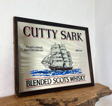 Load image into Gallery viewer, The mirror features the iconic image of the Cutty Sark clipper ship, a renowned tea clipper launched in 1869, which inspired the whisky's name. It also states "From Scotland's best Distilleries" and "86 Proof" (which translates to 43% ABV).