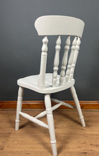 Load image into Gallery viewer, This sturdy spindle back chair is a classic style of wooden chair featuring a seat, a backrest, and a series of turned spindles that connect them.