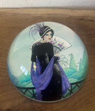 Load image into Gallery viewer, Vintage Art Deco style glass paperweight featuring an illustration of a woman, often referred to as a "flapper lady" or "Gatsby lady" due to the 1920s aesthetic.
