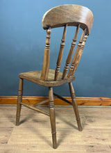 Load image into Gallery viewer, This style is a type of Windsor chair, a design that originated in England in the early 18th century and is characterised by its solid wooden seat into which the legs and spindles of the back are inserted.
