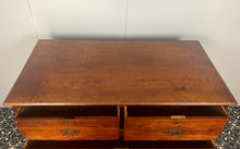 Load image into Gallery viewer, An immaculate quality Arts & Crafts chest of drawers made in figured English mahogany. Having an arrangement of 2 over 2 drawers, all retaining the original decorative handles and escutcheons. With mahogany sides on a plinth. Beautiful original condition throughout. English, Circa 1900.