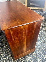 Load image into Gallery viewer, An immaculate quality Arts & Crafts chest of drawers made in figured English mahogany. Having an arrangement of 2 over 2 drawers, all retaining the original decorative handles and escutcheons. With mahogany sides on a plinth. Beautiful original condition throughout. English, Circa 1900.