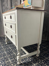 Load image into Gallery viewer, Beautiful vintage shabby chic dressing table with a stylish mirror and sleek drawers. This piece features a painted finish country cream with a contrasting natural wooden top, its distinctive floral patterned drawer fronts add a unique touch.