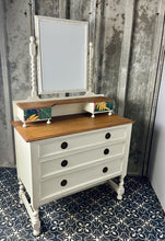 Load image into Gallery viewer, Beautiful vintage shabby chic dressing table with a stylish mirror and sleek drawers. This piece features a painted finish country cream with a contrasting natural wooden top, its distinctive floral patterned drawer fronts add a unique touch.