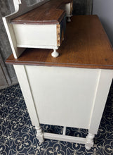 Load image into Gallery viewer, Beautiful vintage shabby chic dressing table with a stylish mirror and sleek drawers. This piece features a painted finish country cream with a contrasting natural wooden top, its distinctive floral patterned drawer fronts add a unique touch.