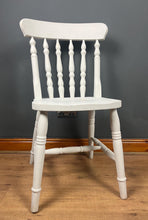 Load image into Gallery viewer, This sturdy spindle back chair is a classic style of wooden chair featuring a seat, a backrest, and a series of turned spindles that connect them.